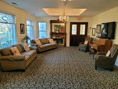 Common area with comfortable seating and a piano