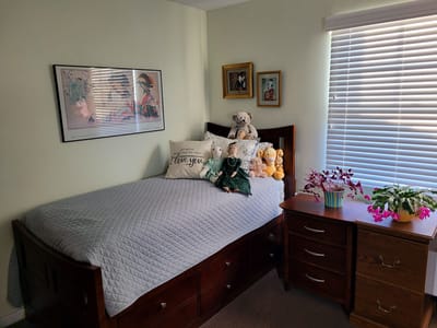 Cozy resident room with a bed and personal decor