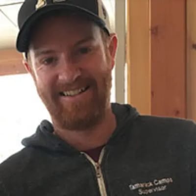 Smiling staff member in casual attire