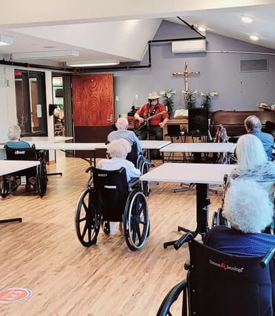 Residents listening to live music in a common area