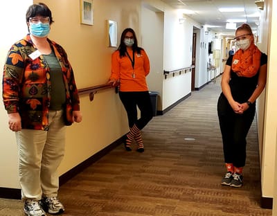 Staff members in a hallway of the assisted living facility