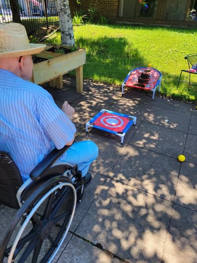 Resident participating in outdoor game activities