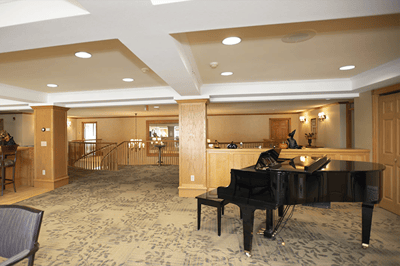 Interior view of a common area with a piano