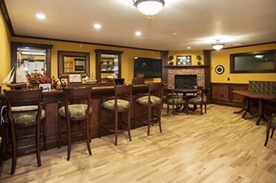 Interior view of a common lounge area with bar seating