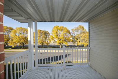 View from a balcony overlooking colorful trees