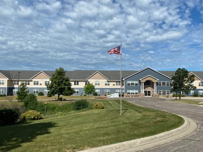 Exterior view of the facility with landscaped grounds