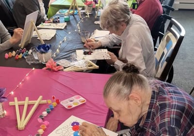 Residents engaging in a creative art activity