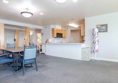 Bright common area with seating and kitchenette