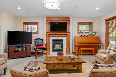 Cozy common area with a fireplace and seating