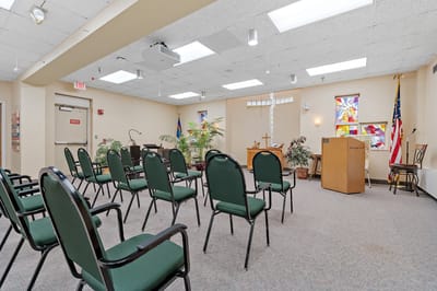 Interior view of a common area with chairs and podium