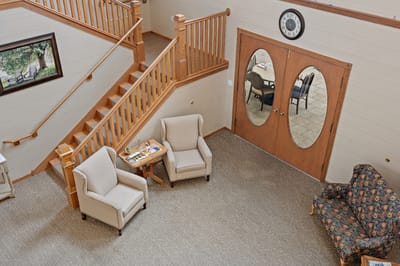 Interior common area with chairs and a door