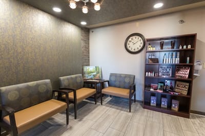 Cozy lobby area with seating and a clock