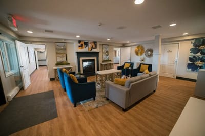 Bright common area with comfortable seating and fireplace