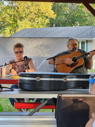 Musicians performing at an outdoor gathering