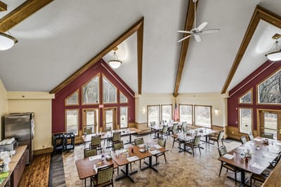 Interior view of a spacious dining room with tables