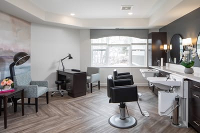 Hair salon area with styling chairs and modern decor