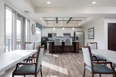 Interior view of a common area with seating and kitchen