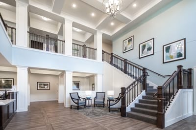 Bright and inviting lobby area with staircase