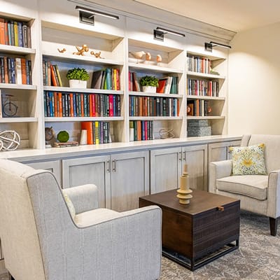 Cozy common area with bookshelves and seating