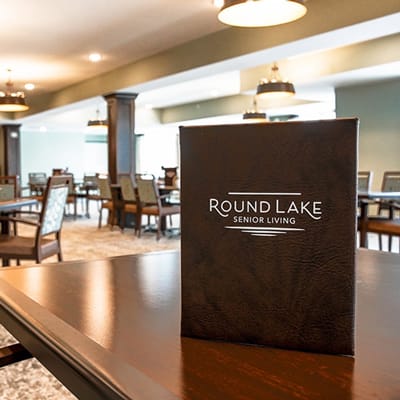 Dining area at Round Lake Senior Living with table settings