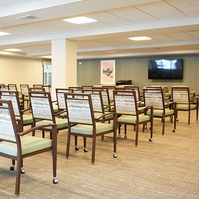Common area with rows of chairs in an activity room