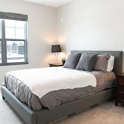 Cozy bedroom with bed and window