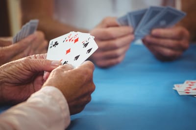 Residents playing cards in a common area
