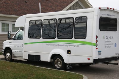 Facility transport van parked outside building