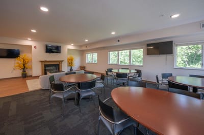Bright common area with tables and chairs