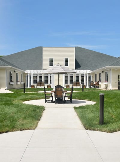 Outdoor patio area with seating and grass