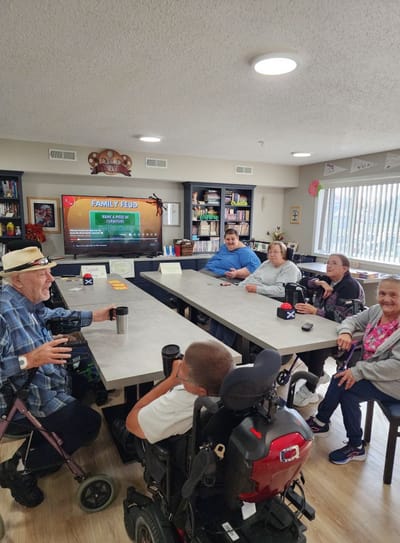 Residents participating in a group activity in a common area