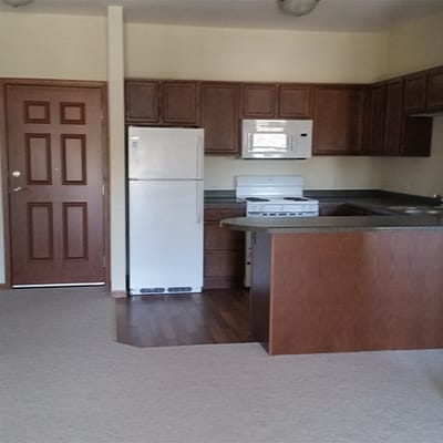 A clean kitchen area in a senior living unit
