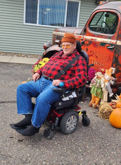 Resident enjoying the outdoors with seasonal decorations