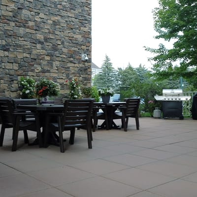 Patio area with seating and greenery