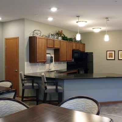 Modern common area with a kitchenette and seating