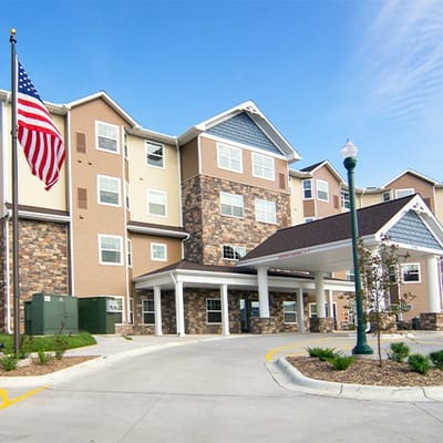 Building exterior with American flag and entrance