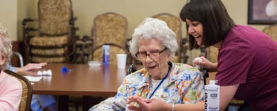 Staff member interacting with a resident in a common area