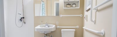 Brightly lit bathroom with safety features