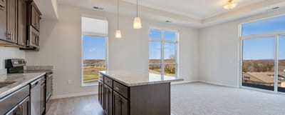 Bright, spacious interior with kitchen views
