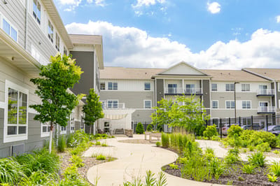 Beautiful garden and walking path at a senior living facility