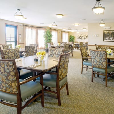 Dining room with tables and floral centerpieces