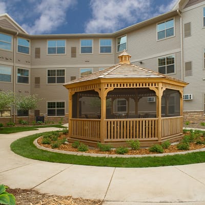 Outdoor gazebo surrounded by landscaped gardens