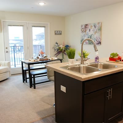 Spacious interior of a model apartment with kitchen and living area