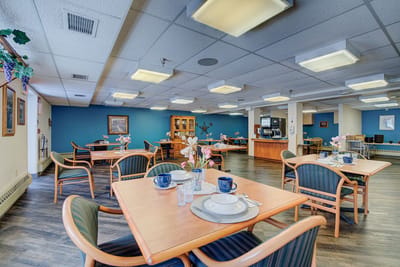 Dining area with tables set for residents