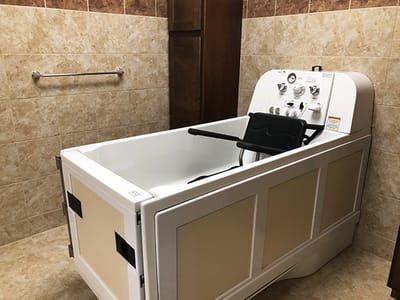 Accessible hydrotherapy tub in a private bathroom