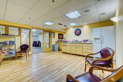 Bright interior common area with seating and games