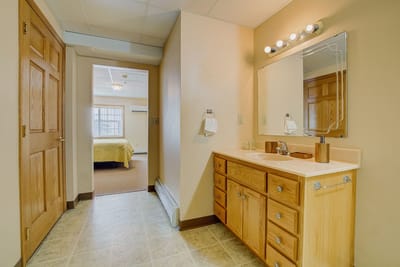 Interior view of a resident bathroom and bedroom