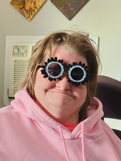 Resident wearing playful oversized sunglasses