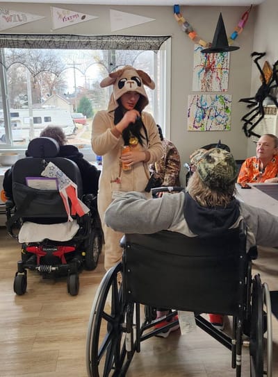 Residents engaging in a lively activity in the common area