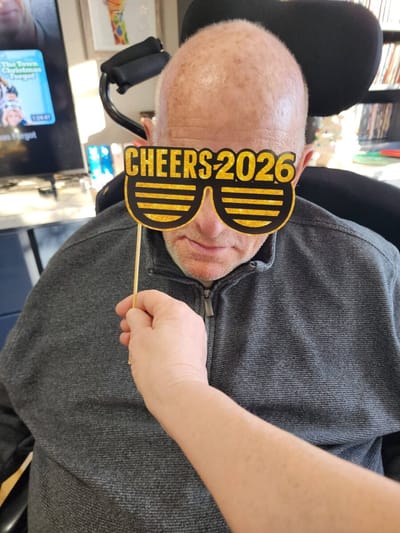 Resident holding a fun sign at an event